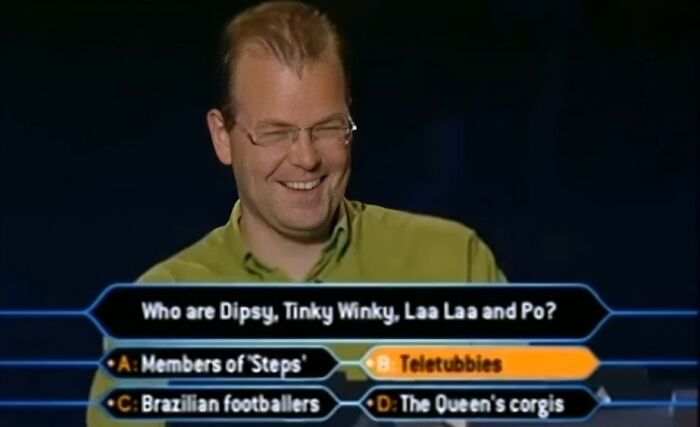 A contestant on Who Wants To Be A Millionaire smiling, with the correct dumb answer Teletubbies highlighted.