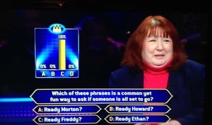 A woman looking puzzled at a dumb Who Wants To Be A Millionaire question about common phrases, showing no clear answer.