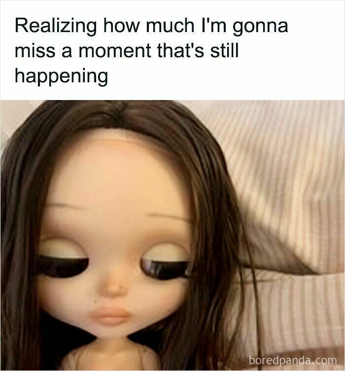 A sad-looking doll with large eyes and dark hair, reflecting funny posts about being a woman and missing moments.