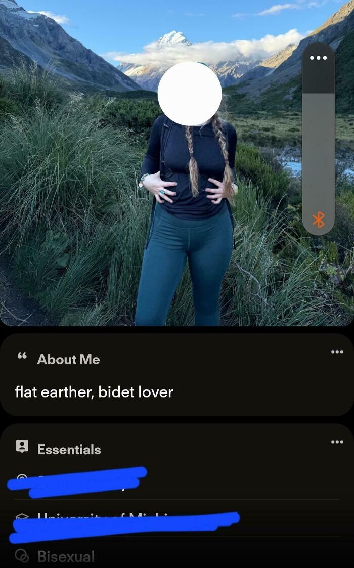 A cringe Tinder profile with a person standing outdoors, bio says flat earther, bidet lover. It's one of the cringe Tinder profiles.
