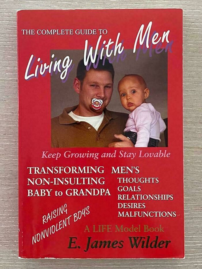 Funny unhinged book cover titled Living With Men with a man sucking a pacifier