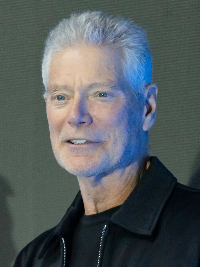 Close-up of Stephen Lang, an actor with bio and career highlights, smiling lightly and looking slightly to the left.