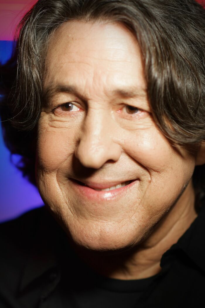 Close-up of Cameron Crowe, a smiling man with dark, wavy hair, showcasing his career highlights and bio.