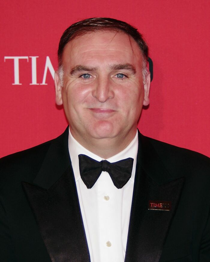 José Andrés, renowned chef and humanitarian, in a career highlight event, wearing a black tuxedo with a bow tie.