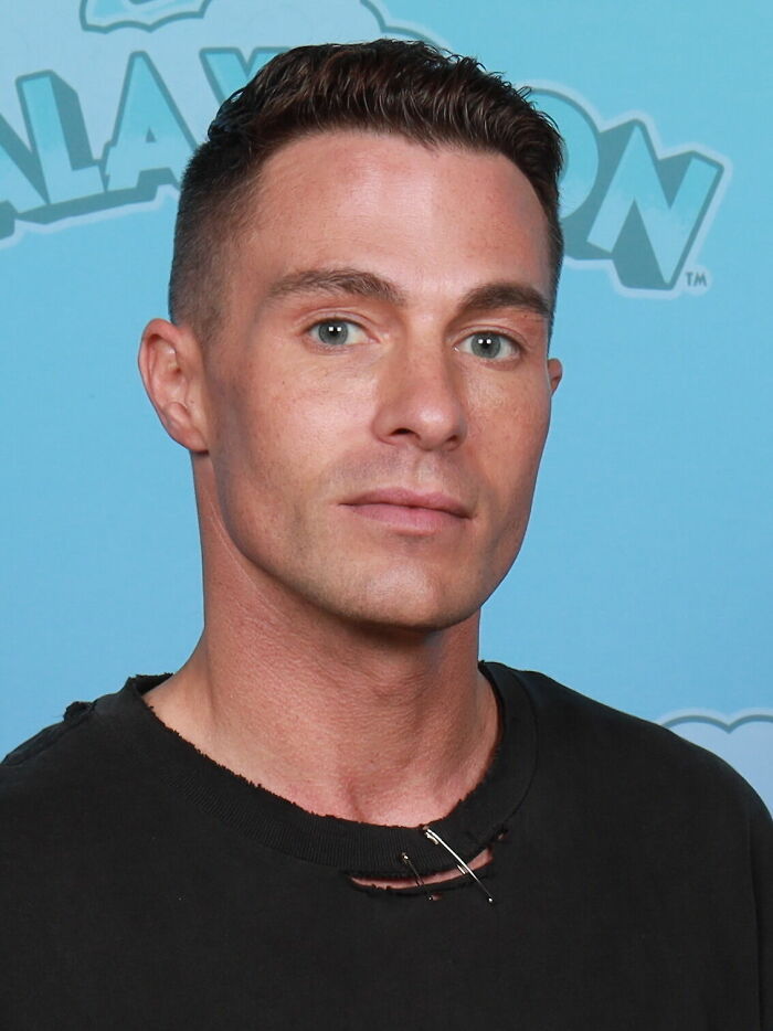 Close-up of Colton Haynes, featuring his face and shoulders, highlighting his bio and career highlights.