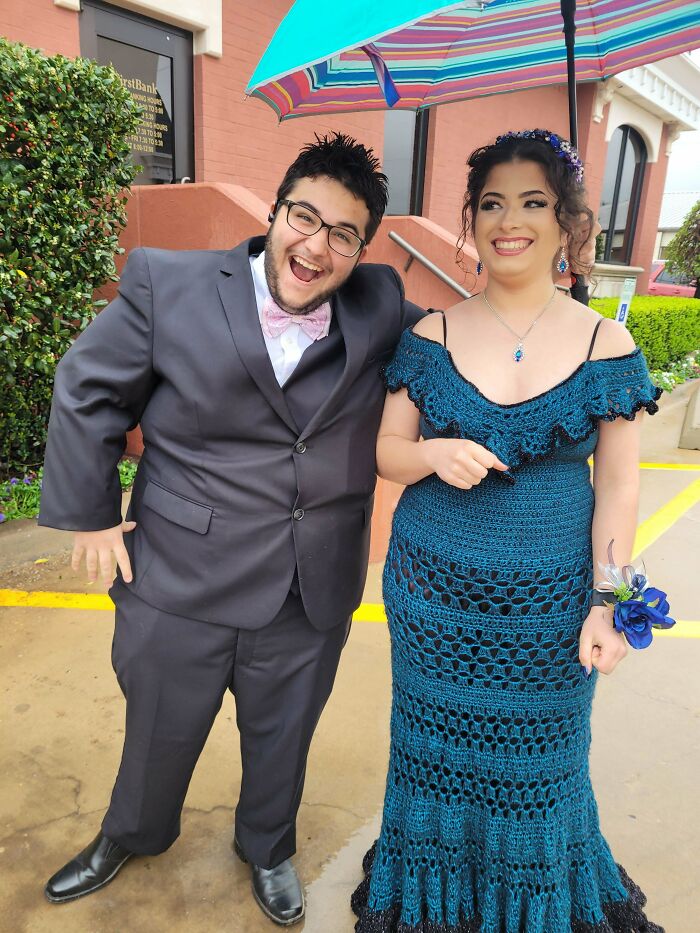 A couple smiling, with the woman wearing a beautiful DIY crochet dress, showcasing useful crochet creations.