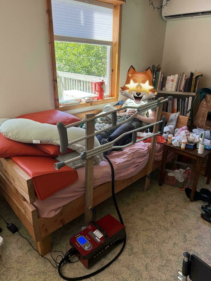 Crutches repurposed as bed rails, demonstrating people turning random junk into clever solutions.