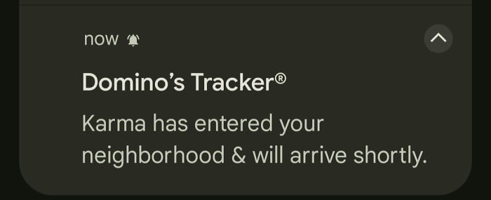 A mobile notification displaying a creepy message: Karma has entered your neighborhood & will arrive shortly.