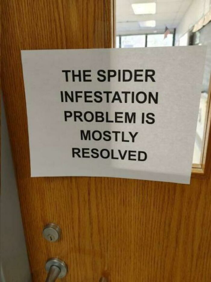 A creepy image of a sign on a door stating The spider infestation problem is mostly resolved, hinting at nightmare fuel.
