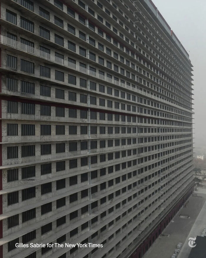 A massive, imposing building with hundreds of identical windows, an unsettling and creepy image.
