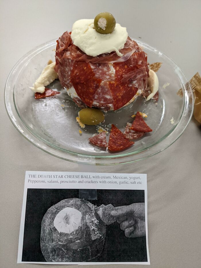 A D***h Star cheese ball covered in various meats and toppings, an example of disgusting food.