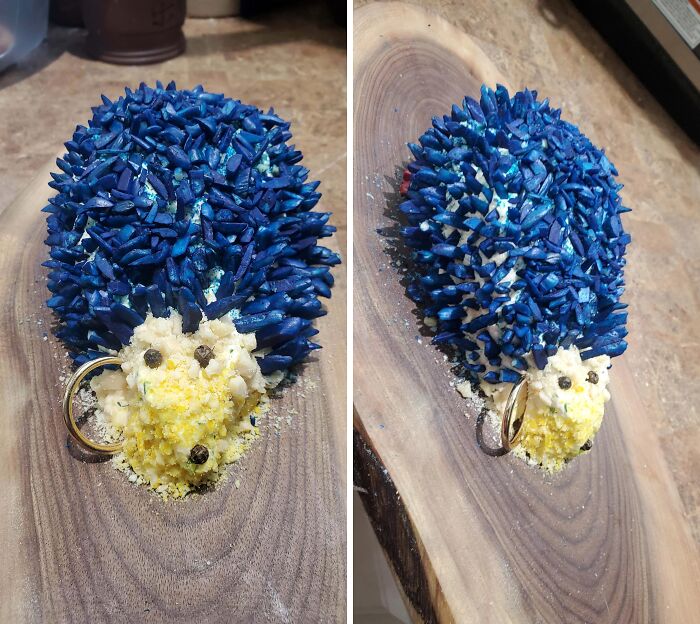 A hedgehog-shaped creation with blue and yellow ingredients, a truly disgusting food presentation.