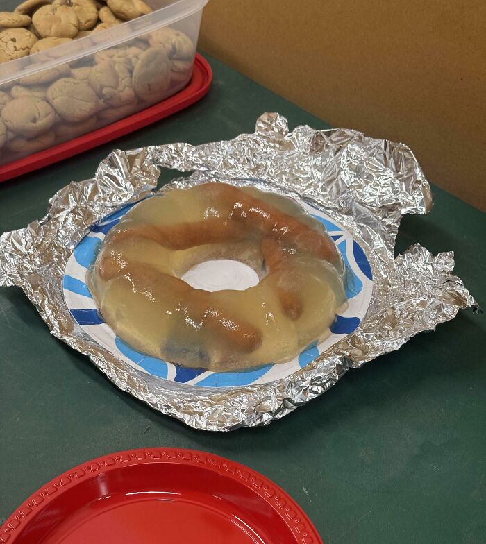 A gelatin mold containing hot dogs and possibly other ingredients, an unappetizing example of disgusting food.