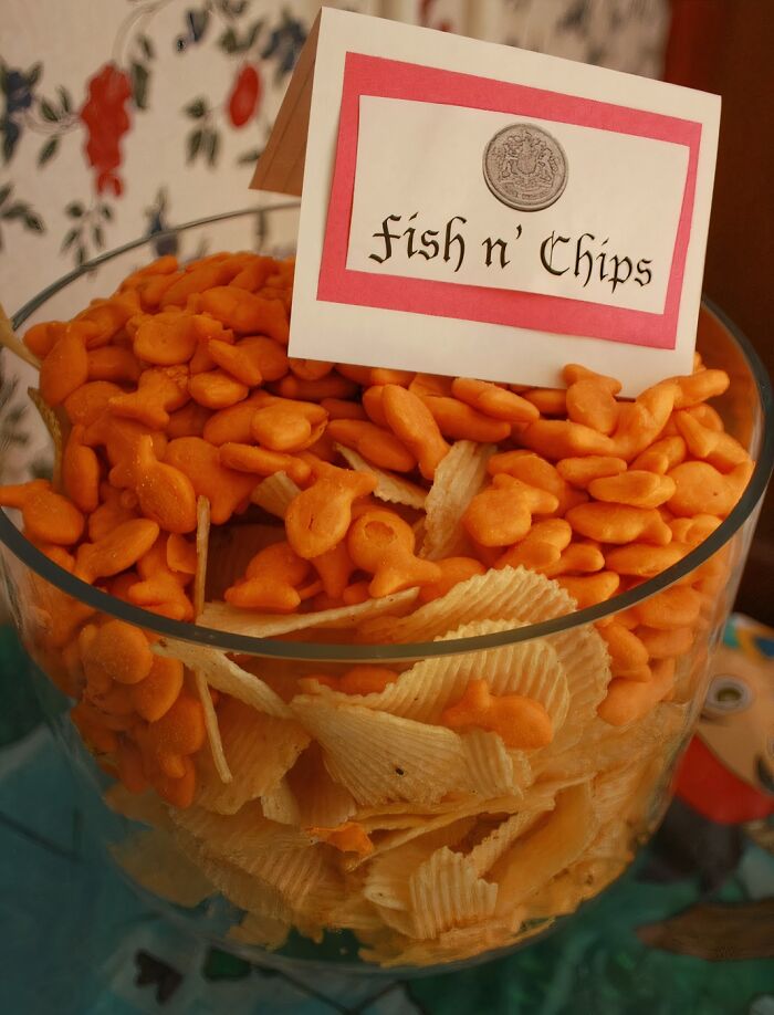 A bowl of goldfish crackers and potato chips labeled Fish n' Chips, a piece of disgusting food.