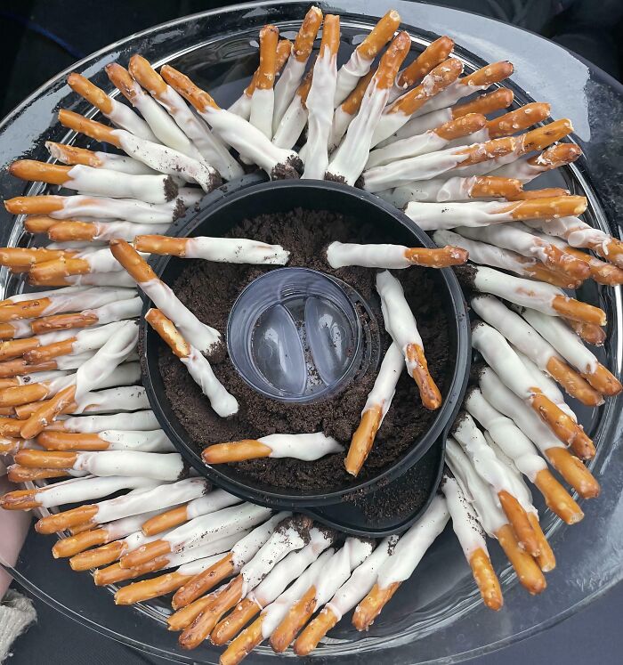 White chocolate-dipped pretzels arranged in a circular platter, a visually interesting yet potentially disgusting food.