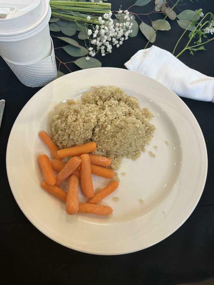 A plate with plain quinoa and baby carrots, illustrating another example of stupid vegan food.