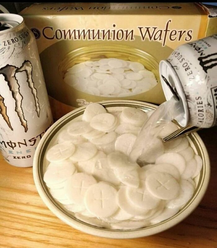 A can of Monster Energy Zero Sugar pours liquid over communion wafers in a bowl, a form of stupid vegan food.