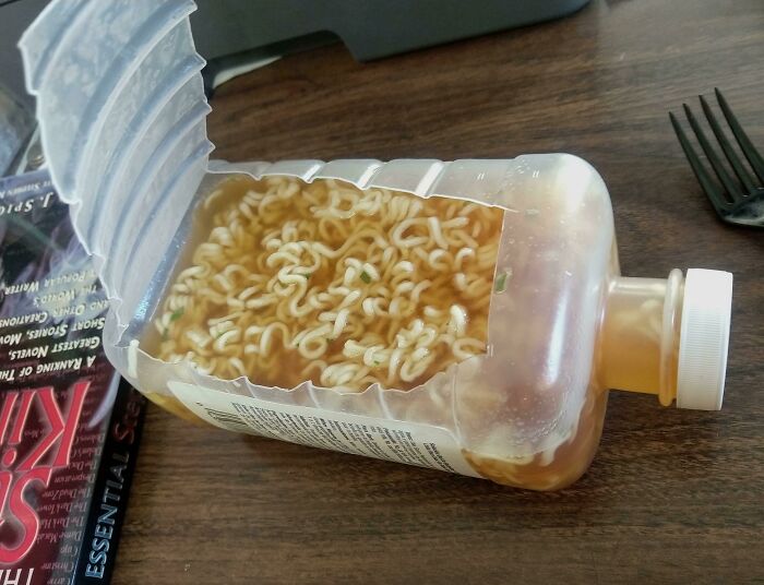 Ramen noodles cooked inside a plastic bottle, a questionable and stupid food preparation.