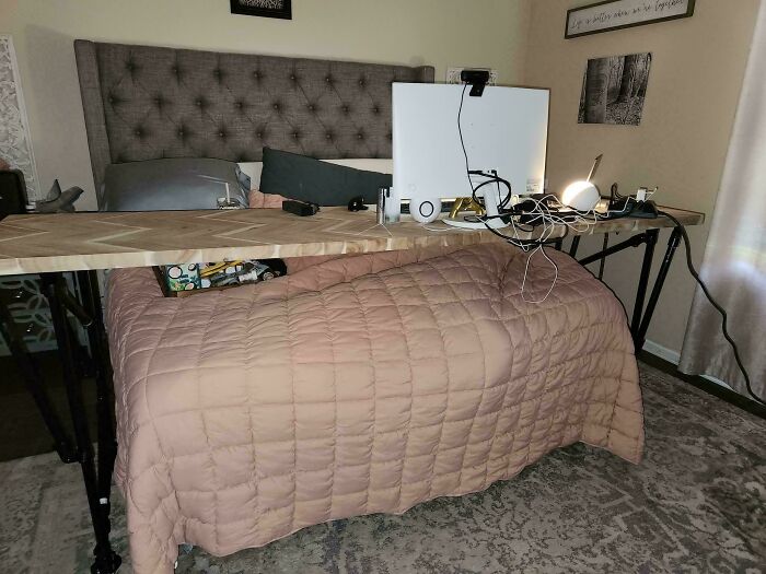 Creative Home DIY Projects: A cozy bedroom with a large tufted headboard and a custom-built desk over the bed.