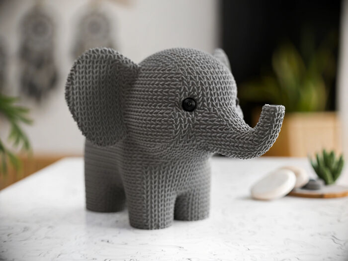 A textured grey elephant figurine, a cool and useful thing people printed with their 3D printers.