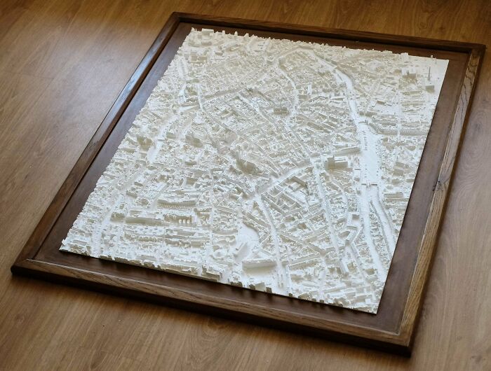 A detailed white 3D printed map of a city, a cool thing people printed with their 3D printers.