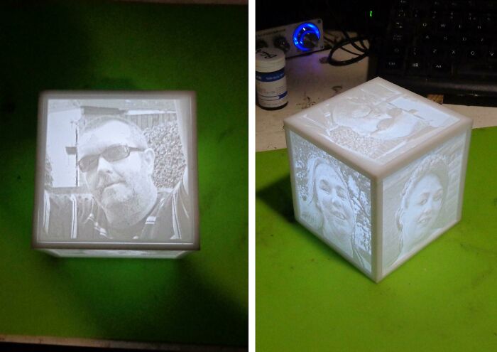 A glowing cube with 3D printed images of people on its sides, showcasing cool things people printed with their 3D printers.