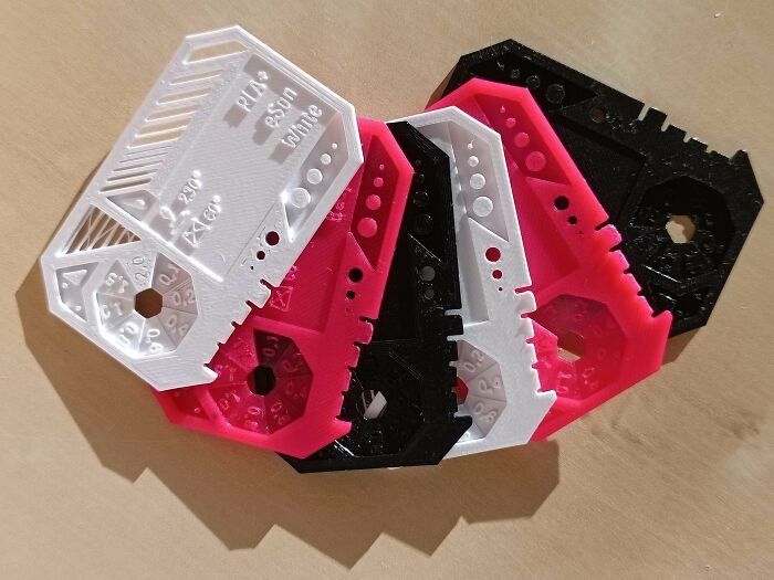 A fan of colorful calibration cards, among the useful things people printed with their 3D printers.