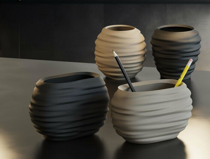 Stylish 3D printed desk organizers in various colors, useful things people printed with their 3D printers.