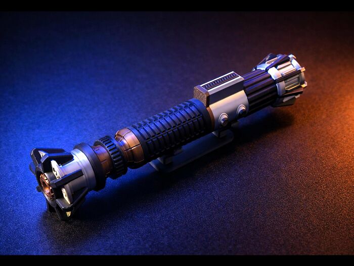 An elegant 3D printed lightsaber replica, showcasing useful things people printed with their 3D printers.