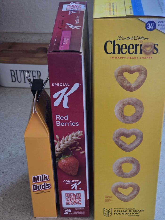 Breakfast cereals and Milk Duds showcase a 400% price difference and insulting consumerism in product packaging.