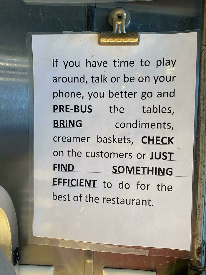 A sign listing tasks for service industry workers, highlighting the demanding nature of their job.