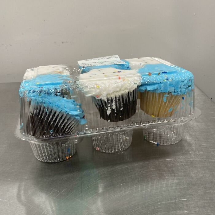 Cupcakes with blue and white frosting, demonstrating poor presentation by service industry workers at a bakery.