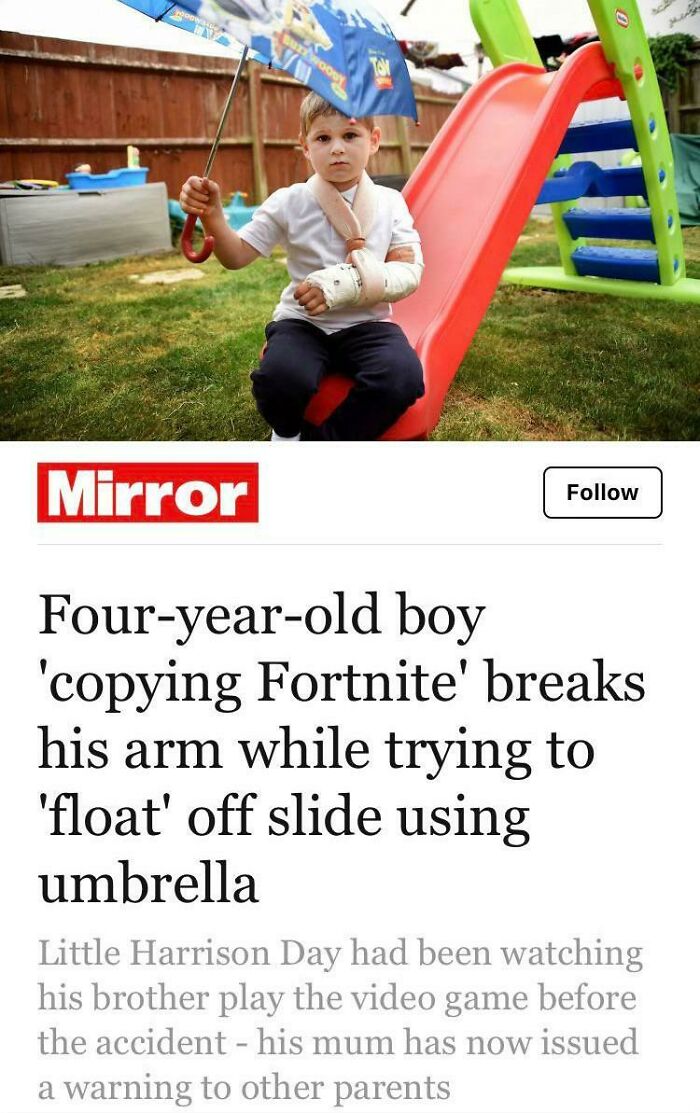A young boy with a broken arm after trying to float off a slide with an umbrella, displaying stupidity.