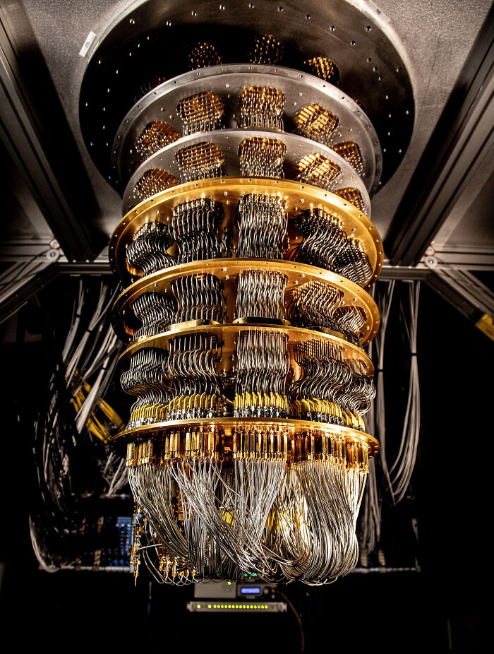 Close-up of a complex, multi-tiered quantum computer, showcasing advanced technologies that make everyday life easier.