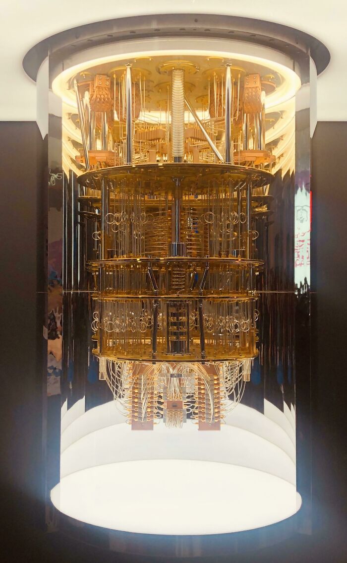 Full view of a quantum computer with glowing bottom, highlighting the genius technologies that improve everyday life.
