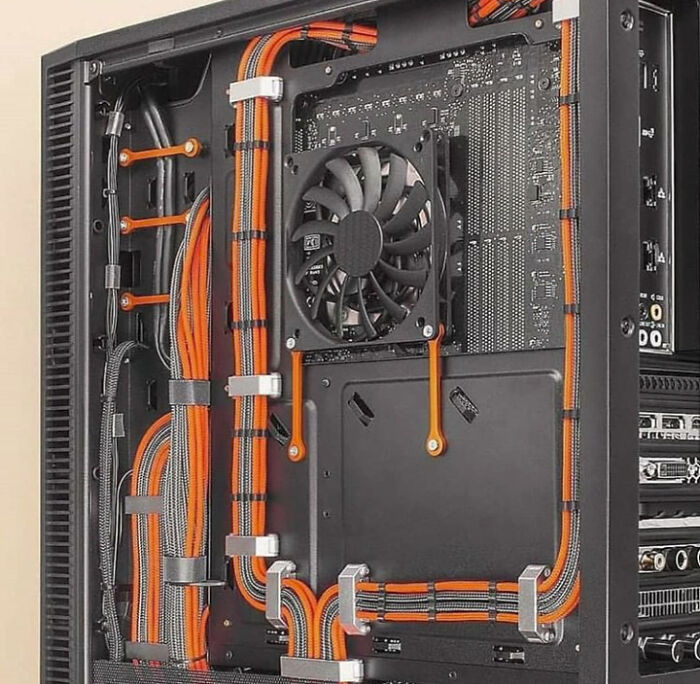 Neatly organized internal computer wiring, showcasing brilliant technologies that power everyday life.