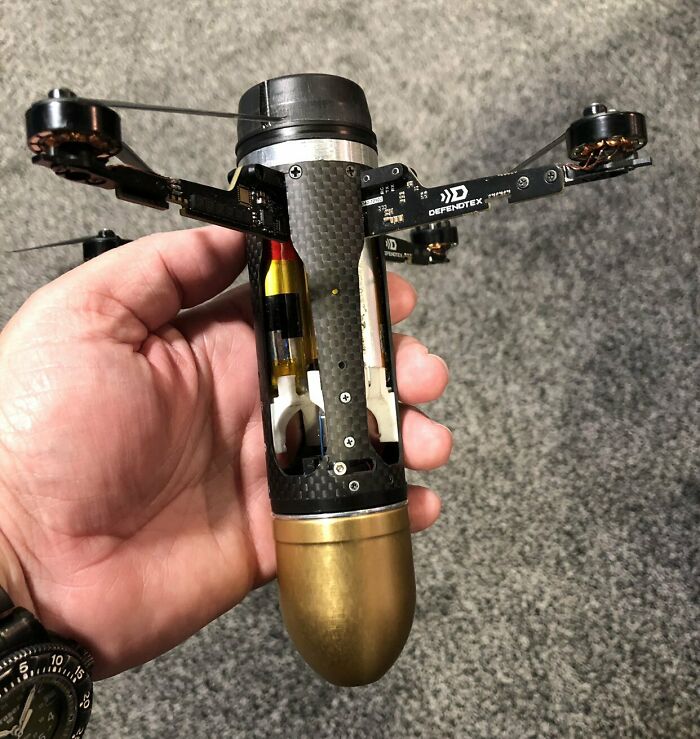 A hand holding a compact drone, an example of genius technologies that make everyday life easier.