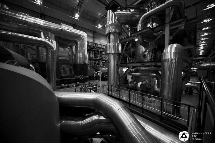 Industrial pipes and machinery in a power plant, symbolizing the genius technologies making everyday life easier.