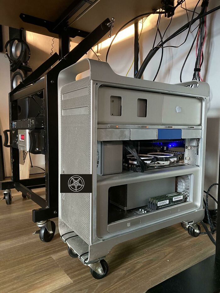 A powerful computer tower on wheels, displaying complex hardware, a testament to genius technologies.