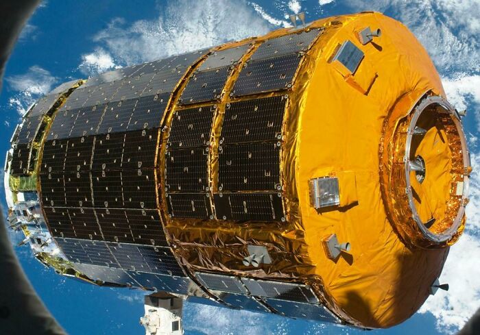 The golden module of the Japanese Experiment Module Kibo in space, a marvel of genius technology.