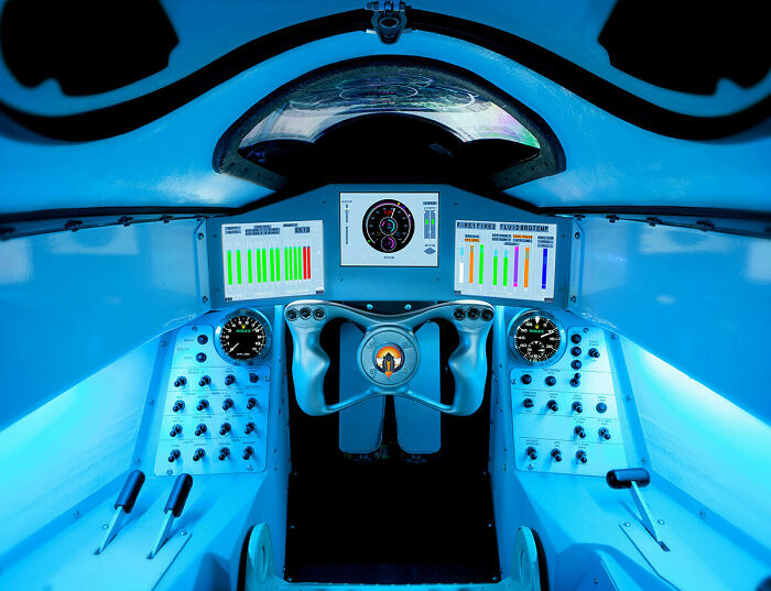 The interior cockpit of a futuristic vehicle, featuring various technologies to make everyday life easier and satisfying.
