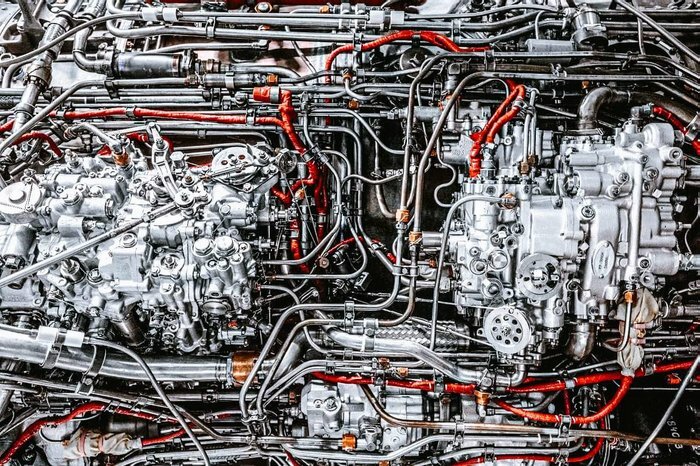 Intricate network of pipes and wires within a machine, showcasing advanced technologies that make everyday life easier.