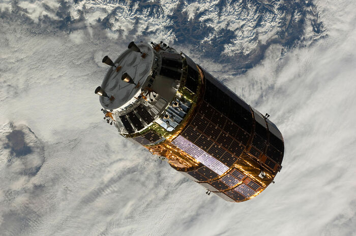 A satellite orbiting Earth, a testament to genius technologies that make everyday life easier through global communication.