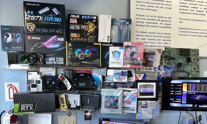 A wall displaying various computer components and software, representing genius technologies for everyday life.