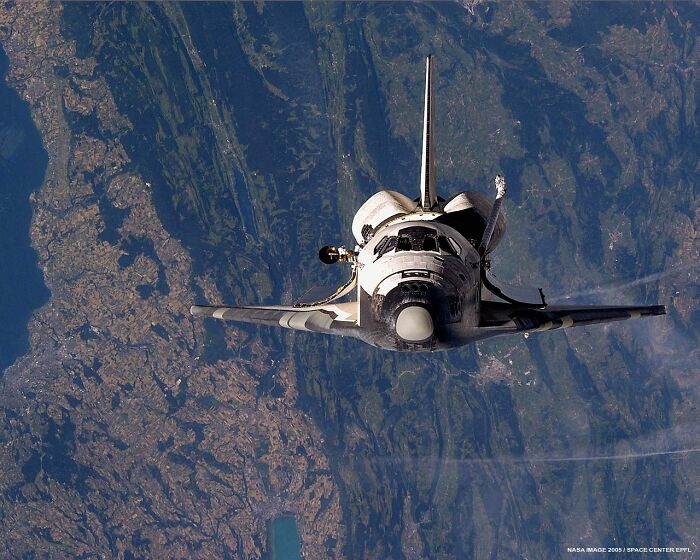 A space shuttle flying high above Earth, a testament to genius technologies that expand our understanding and make everyday life easier.