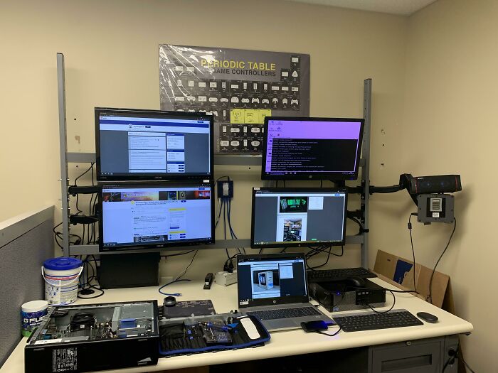 A multi-monitor computer setup showing various technologies that make everyday life easier, including a laptop and tools.