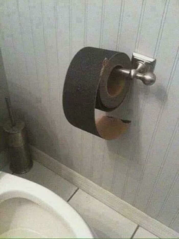 A roll of sandpaper on a toilet paper holder, one of the creepy and confusing images.