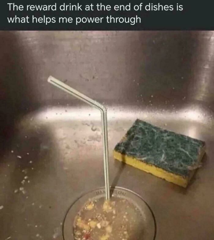 A creepy and confusing image of a straw in a sink filled with dirty dishwater, needing a priest.