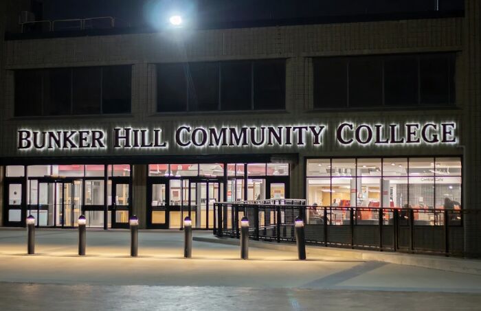 Bunker Hill Community College building illuminated at night, a place for wholesome people to learn and grow.