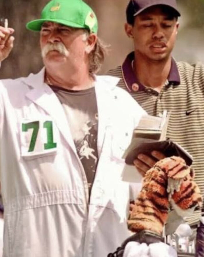 Tiger Woods' Caddie Checking The Wind With His Cigarette At The 1997 Masters